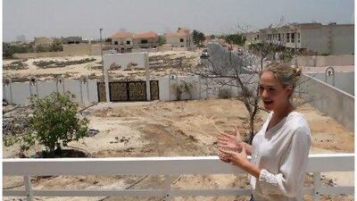 Lucy Bruce, a co-founder of Home Grown, stands in front of a plot of land being converted into the nursery’s garden. When finished the garden will include windmills and animal sculptures.