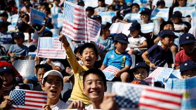 A US supporter waves the US flag before the Japan 2019 Rugby World Cup Pool C match between Argentina and the United States at the Kumagaya Rugby Stadium in Kumagaya. AFP