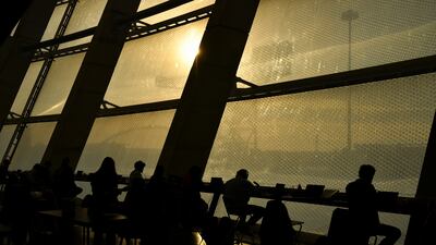 Delegates are silhouetted at the summit venue. Reuters
