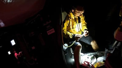 Justin Slattery of Abu Dhabi Ocean Racing inspects a broken halyard lock at night during the Volvo Ocean Race's third leg on Friday. Matt Knighton / Abu Dhabi Ocean Racing / Volvo Ocean Race / January 23, 2015