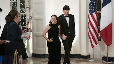Actress Julia Louis-Dreyfus, left, and son Charles Hall arrive. Bloomberg