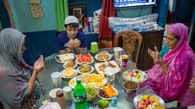 Bangladeshi family members eat iftar in Dhaka, Bangladesh. EPA