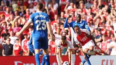Abdoulaye Doucoure of Everton tackles Gabriel of Arsenal. Getty Images