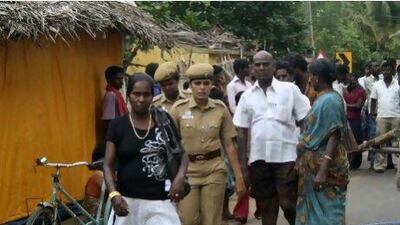 Indian policewomen escort Sri Lankan pilgrims after they were mobbed by locals in Thanjavur district in Tamil Nadu state this week.