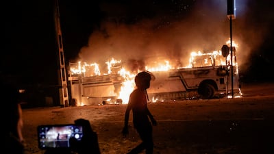 A bus burns close to the residence of Sri Lankan President Gotabaya Rajapaksa in Colombo. Reuters