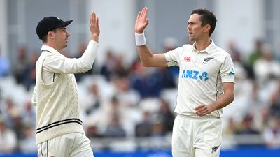 New Zealand bowler Trent Boult is congratulated by Will Young after taking his fifth wicket of Matthew Potts. Getty