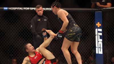Weili Zhang battles Carla Esparza during their Women Strawweight fight at UFC 281. Getty