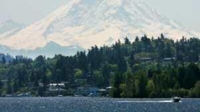 Mount Rainier looms over Lake Washington, near Seattle. Experts believe it poses much more danger than Mount St Helens.