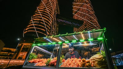 A street vendor sells prawns on the seafront promenade at Galle Face in Colombo, Sri Lanka. AFP