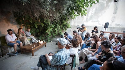 A conversation among Hedi Khelil, Khadija Hamdi-Soussi and Yazid Oulab in the "earth" pavilion, sited in the Mausoleum Sidi Boukhrissane in Tunis