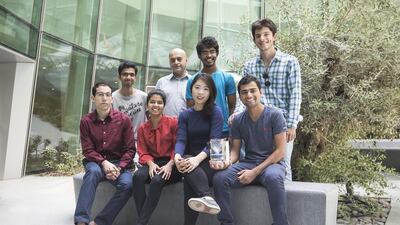Front, from left, Kenan Jiakli, a mentor, Dhanya Baby, Tina Kim and Krishna Gaire; back, from left, Muhammad Mirza, Kourosh Salehi-Ashtiani, Sahan Tampoe and Jovan Jovancevic. They won a bronze for a self-sustaining mosquito trap. Mona Al Marzooqi / The National