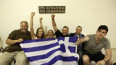 From left, Greek expatriates Kostas Koumanidis, Xenia Rozi, Dia Chatzidimou, George Ioannidis, Theologis Sarvanis and Alexandros Katsikogiannis are ready to enjoy the World Cup, even if they do not expect a lot from their team. Jaime Puebla / The National