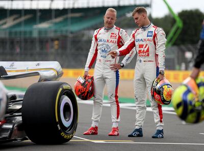 Haas drivers Nikita Mazepin, left, and Mick Schumacher on the grid ahead of the British Grand Prix at Silverstone. PA