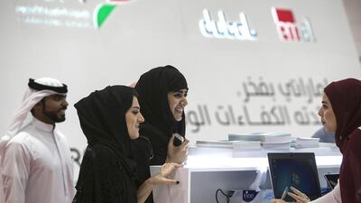 Emirati nationals at Tawdheef, a job fair open to UAE citizens only, at the Abu Dhabi National Exhibition Centre. Silvia Razgova / The National