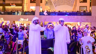 Fans at Yas Mall in Abu Dhabi watch Manchester City beat Inter Milan to win the Champions League final. Khushnum Bhandari / The National