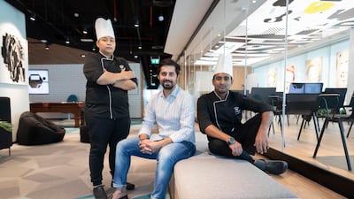 Pranav Arora with chefs Casey Catingan, left, and Anand Bhutia, right. HeyChef was launched in May last year with only two chefs, but now has six. Photo: Antonie Robertson / The National
