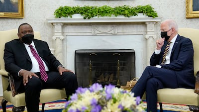 US President Joe Biden, right, listens as Kenyan President Uhuru Kenyatta, left, speaks during their meeting in the Oval Office of the White House in Washington. AP