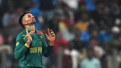 South Africa's Keshav Maharaj celebrates after taking the wicket of New Zealand's Daryl Mitchell. AFP
