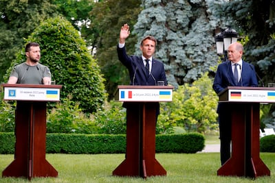 (L-R) Ukraine's President Volodymyr Zelenskyy hosted France's Emmanuel Macron and Mr Scholz in Kyiv in June. AP