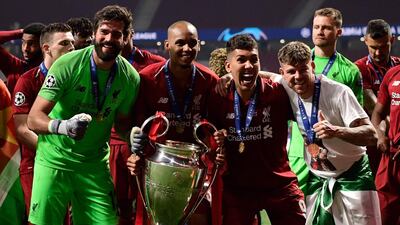 Alisson celebrates with his Liverpool teammates after their Champions League win. AFP