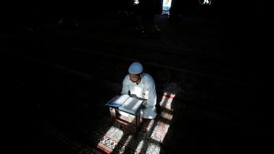 A Kashmiri man reads the Quran in Srinagar. Reuters