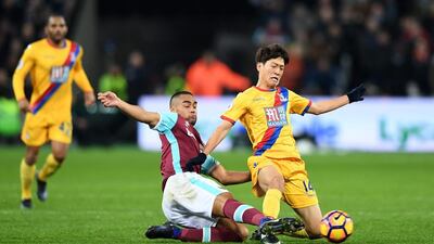 Winston Reid of West Ham United, left. Shaun Botterill / Getty Images