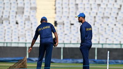 Sri Lanka captain Dimuth Karunaratne inspects the pitch on Thursday. AFP