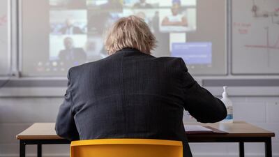 Students join Boris Johnson remotely to take part in the class. Reuters