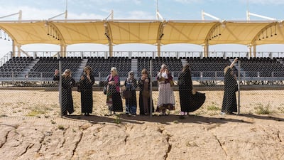 Curious western tourists try to access the camel races. Maxime Fossat for The National