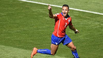 Chile forward Alexis Sanchez celebrates after scoring against Brazil on Saturday in the last-16 of the 2014 World Cup. Odd Andersen / AFP