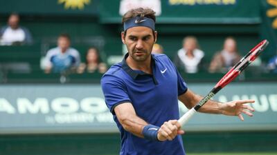 Roger Federer does not see why he should retire so long as he enjoys playing tennis. Friso Gentsch / AP Photo