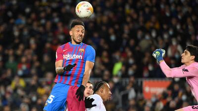 Barcelona striker Pierre-Emerick Aubameyang heads the ball against Sevilla. AFP
