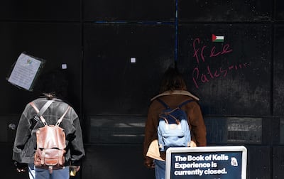 Pro-Palestine graffiti on a gate at an entrance to Trinity College in Dublin. PA