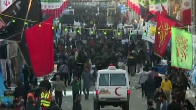 An image grab from a video released by state-run Iran Press news agency on January 3, 2024 shows a vehicle of the Iranian Red Crescent driving near the site where two explosions in quick succession struck a crowd marking the anniversary of the 2020 killing of Guards general Qasem Soleimani, near the Saheb al-Zaman Mosque in the southern Iranian city of Kerman. The blasts, which state television called a "terrorist attack", came with tensions running high in the Middle East a day after Hamas number two was killed in a Beirut drone strike. The blasts stuck near the Saheb al-Zaman Mosque in Kerman, Soleimani's southern hometown where he is buried, as supporters gathered to mark the fourth anniversary of his death in a US drone strike just outside Baghdad airport. (Photo by IRAN PRESS / AFP) / RESTRICTED TO EDITORIAL USE - MANDATORY CREDIT - AFP PHOTO / HO / IRAN PRESS" NO MARKETING NO ADVERTISING CAMPAIGNS - DISTRIBUTED AS A SERVICE TO CLIENTS FROM ALTERNATIVE SOURCES, AFP IS NOT RESPONSIBLE FOR ANY DIGITAL ALTERATIONS TO THE PICTURE'S EDITORIAL CONTENT, DATE AND LOCATION WHICH CANNOT BE INDEPENDENTLY VERIFIED - NO RESALE - NO ACCESS ISRAEL MEDIA / PERSIAN LANGUAGE TV STATIONS / OUTSIDE IRAN / STRICTLY NO ACCESS BBC PERSIAN / VOA PERSIAN / MANOTO-1 TV / IRAN INTERNATIONAL / RADIO FARDA /