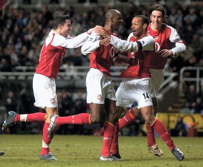 Patrick Vieira, second from left, and Thierry Henry, second from right, combined brilliantly for France and Arsenal. Matthew Lewis / Getty Images