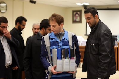 Babak Zanjani, centre, facing a previous trial in a Tehran court. AFP