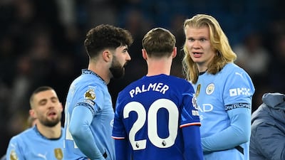 Josko Gvardiol and Erling Haaland of Manchester City speak with Cole Palmer of Chelsea. Getty Images