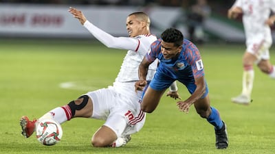 UAE defender Ismail Ahmed wins a tackle.