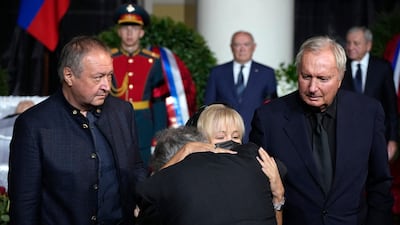 Gorbachev's daughter Irina hugs politician Grigory Yavlinsky in front of her father's casket. AP