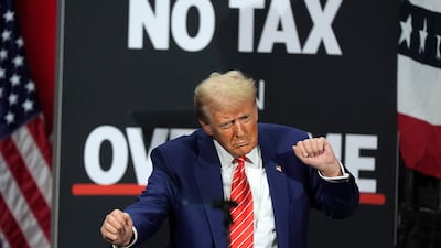 Republican presidential nominee former President Donald Trump dances at a campaign event on October 15, in Atlanta, where he swayed to music for 39 minutes, instead of taking audience questions. AP