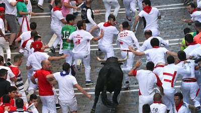 Revellers sprint in front of a bull during the third day of the running of the bulls at the San Fermin festival in Pamplona, Spain. Susana Vera / Reuters