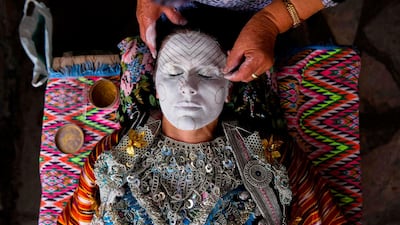 Buqaj receives a traditional face painting. AFP