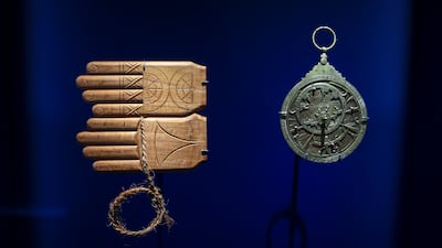A kamal, left, a navigational tool made with wood and string, and an astrolabe, were both instruments used by seafarers