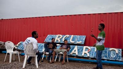 Ethiopian jugglers (L-R) Remedan Tsega, 21, Milkyas Asfaw, 24, Nebyu Almerew, 20, and Abdul Gefar, 14, hang out behind the tent.
