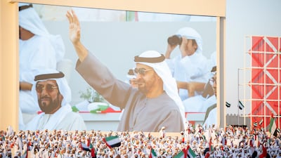 Sheikh Mohamed and Sheikh Tahnoon bin Mohamed, Ruler's Representative in Al Ain Region, seen watching the Union Parade during the Sheikh Zayed Heritage Festival. Abdullah Al Junaibi for the Presidential Court