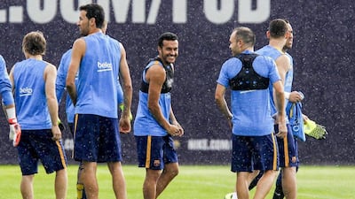 Barcelona's Pedro smiles during Thursday's team training session ahead of the first leg of the Spanish Super Cup on Friday against Athletic Bilbao. Quique Garcia / AFP