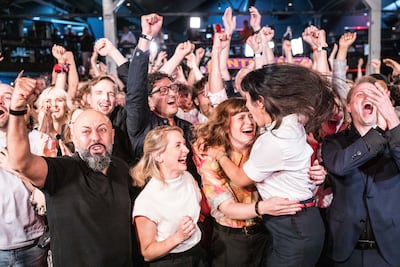 The Left leaders cheer following the closure of polling stations in Berlin state elections. Getty Images