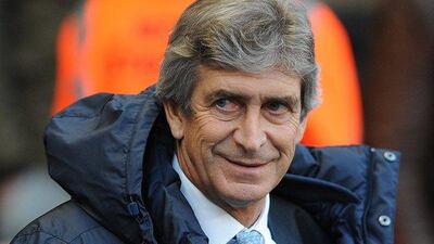 Manchester City manager Manuel Pellegrini believes his side can challenge for four trophies this season after moving top of the Premier League. Peter Powell / EPA