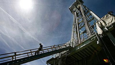 A worker steps down from the drilling platform at the Newberry Crater geothermal project near LaPine, Oregon in 2008.