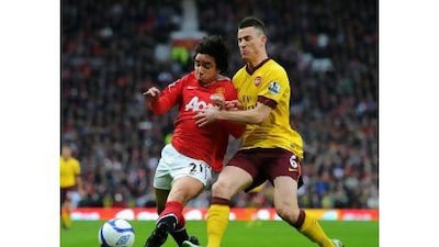 Manchester United and Arsenal lead the battle to become Premier League champions. Clive Mason / Getty Images